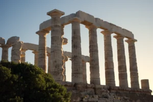 The Temple of Poseidon at Cape Sounio lit by golden sunset light — Athens city and Cape Sounio combo full day private tour