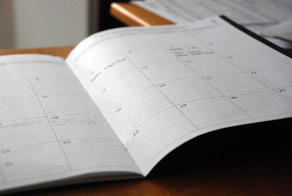 Calendar planning for outward and return dates; illustrative stock photograph, not TransferHub fleet or an actual pickup point
