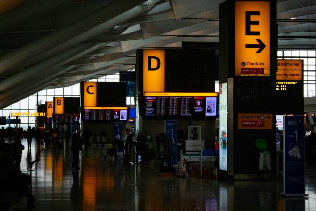 Generic departures-terminal setting for outward-flight planning; illustrative stock photograph, not TransferHub fleet or an actual pickup point